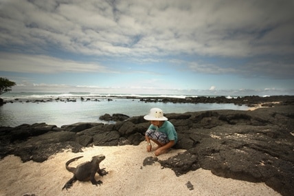 Galapagos iguana with boy